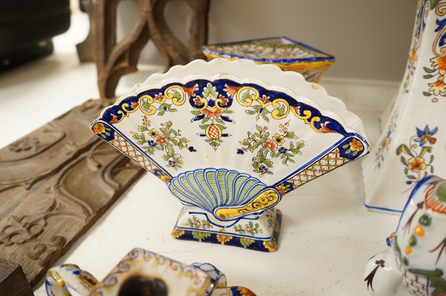 A collection of early 20th century French faience pieces, tallest 37cm